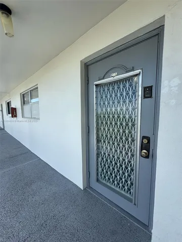 a view of entryway with wooden floor