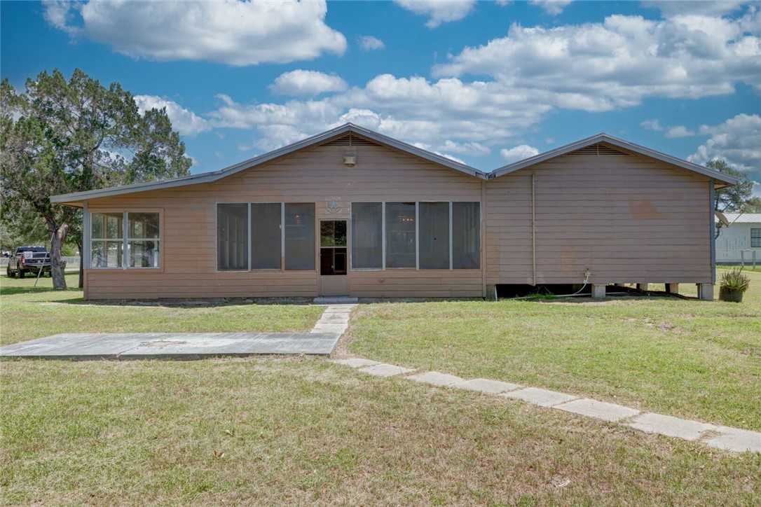 9047 County Road 461 Mathis, TX 78368 - Photo 11 of 38 a view of a house with a yard