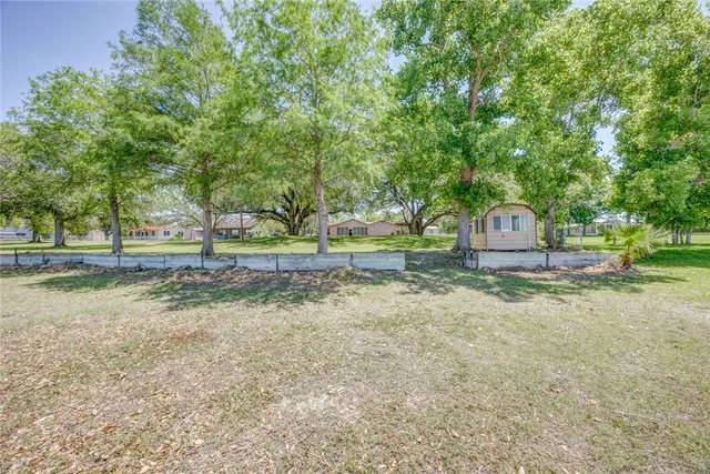 a view of house with yard