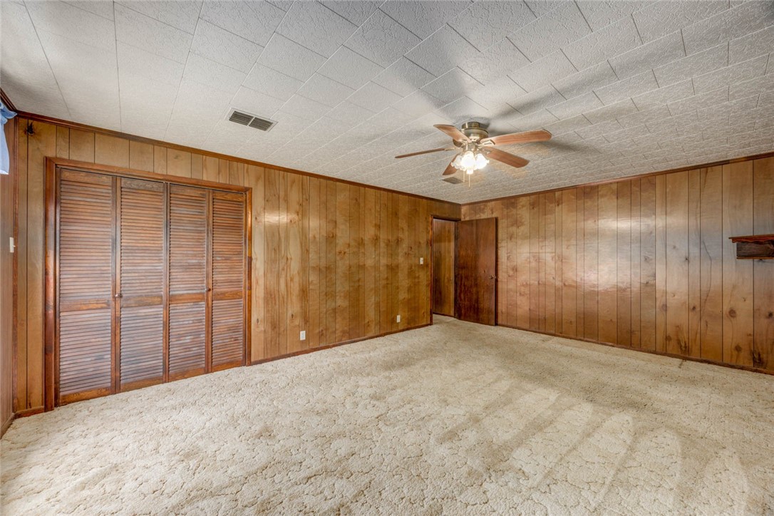 9047 County Road 461 Mathis, TX 78368 - Photo 20 of 38 a view of a livingroom with a ceiling fan and a window