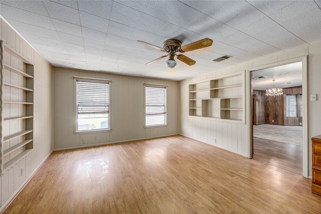 9047 County Road 461 Mathis, TX 78368 - Photo 23 of 38 a view of empty room with wooden floor and fan