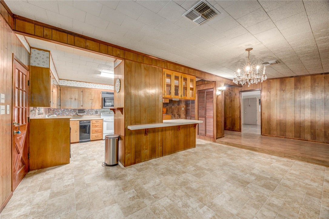 9047 County Road 461 Mathis, TX 78368 - Photo 26 of 38 a view of a kitchen with refrigerator and cabinets