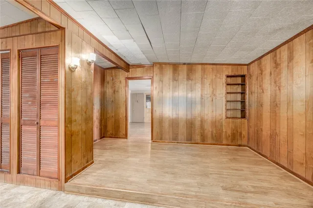 a dining hall with stainless steel appliances granite countertop a granite counter tops and a view of living room