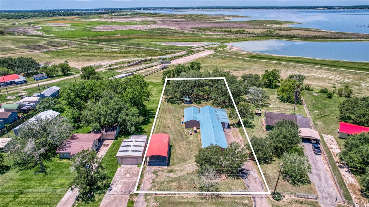 9047 County Road 461 Mathis, TX 78368 - Photo 3 of 38 a view of a yard with an outdoor space