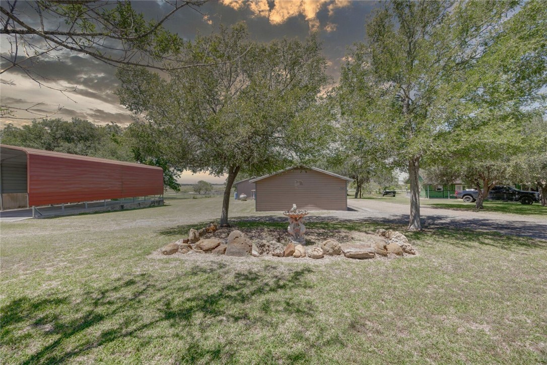 9047 County Road 461 Mathis, TX 78368 - Photo 7 of 38 a backyard of a house with lots of green space