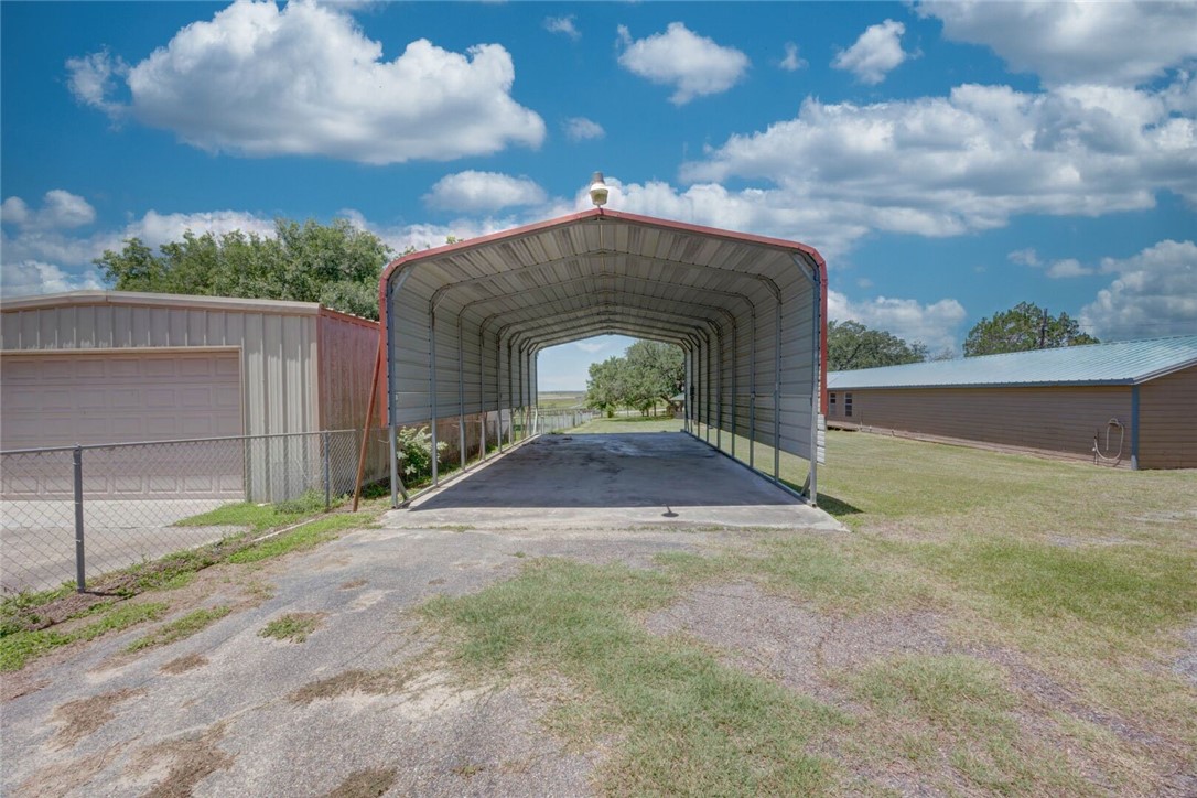 9047 County Road 461 Mathis, TX 78368 - Photo 8 of 38 a front view of a house with a yard