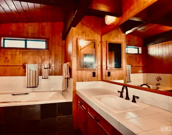 a kitchen with a sink and a refrigerator