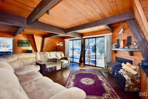 a outdoor living space with furniture and a rug