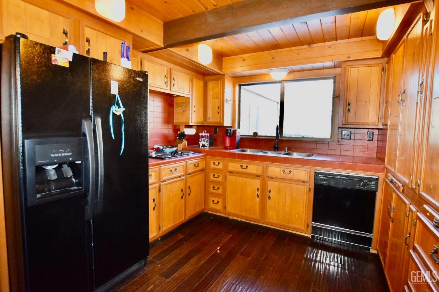 Undisclosed Address Tehachapi, CA 93561 - Photo 5 of 17 a kitchen with stainless steel appliances granite countertop a refrigerator a stove and a sink