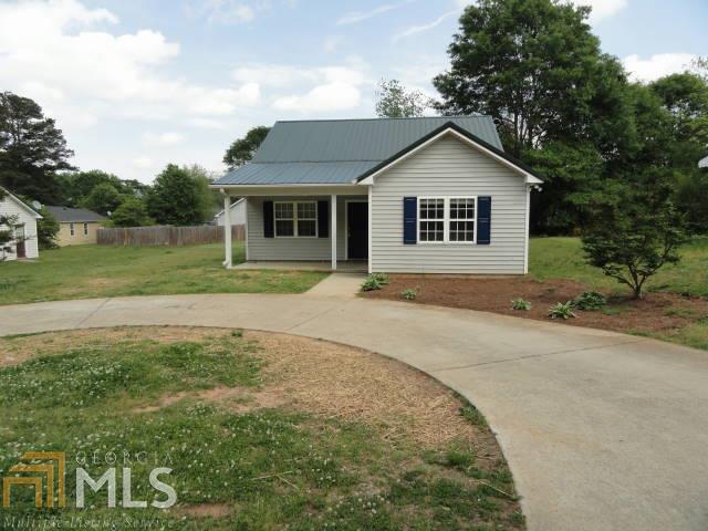 56 Horton Street Winder, GA 30680 - Photo 1 of 1 a front view of house with yard and green space