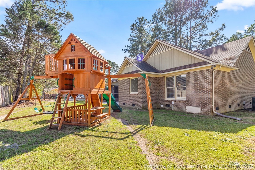 7756 Dragonhead Road Fayetteville, NC 28311 - Photo 38 of 42 a view of a house with a yard