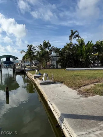 a view of a swimming pool with an outdoor space and seating area