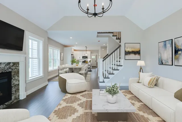 a living room with fireplace furniture and a flat screen tv
