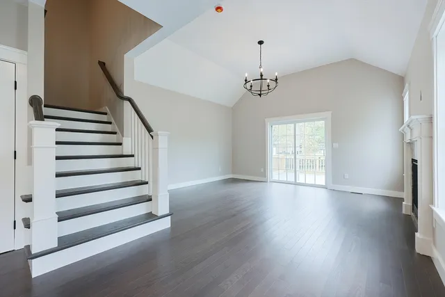 a view of wooden floor and windows in a room