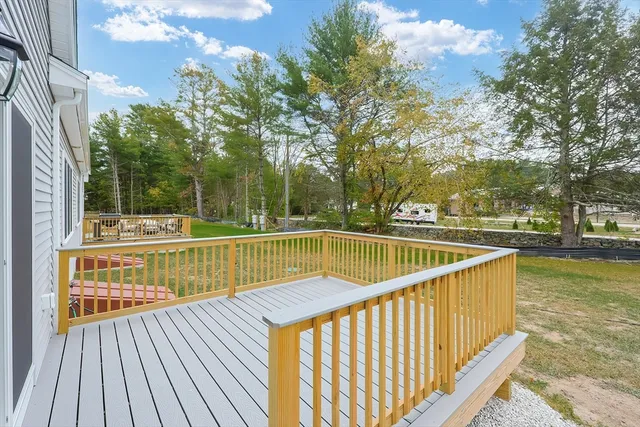 a view of outdoor space with deck and yard