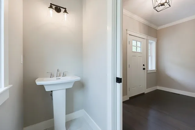 a bathroom with a sink a mirror and shower