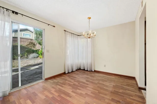 a view of an empty room with a glass door