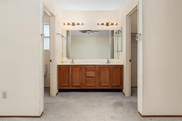 a room with cabinets and a refrigerator