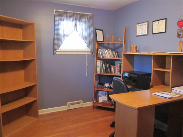 34 Redden Road Springfield, MA 01119 - Photo 9 of 20 a view of workspace with a bookshelf