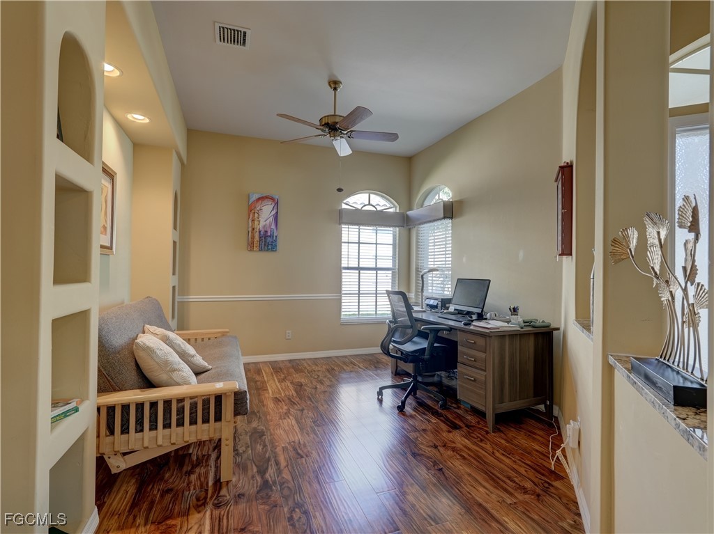 11180 Wine Palm Road Fort Myers, FL 33966 - Photo 14 of 40 a livingroom with workspace and a window