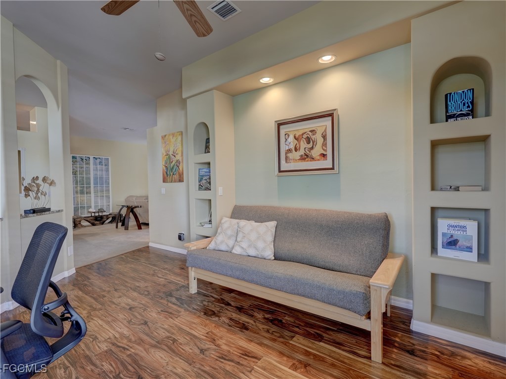 11180 Wine Palm Road Fort Myers, FL 33966 - Photo 16 of 40 a living room with furniture and a wooden floor