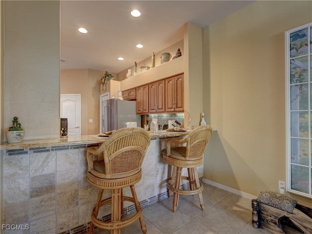 11180 Wine Palm Road Fort Myers, FL 33966 - Photo 18 of 40 a room with a chair and gym equipment