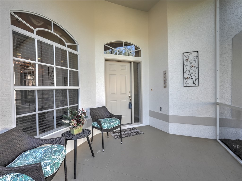 11180 Wine Palm Road Fort Myers, FL 33966 - Photo 2 of 40 a living room with furniture and a window