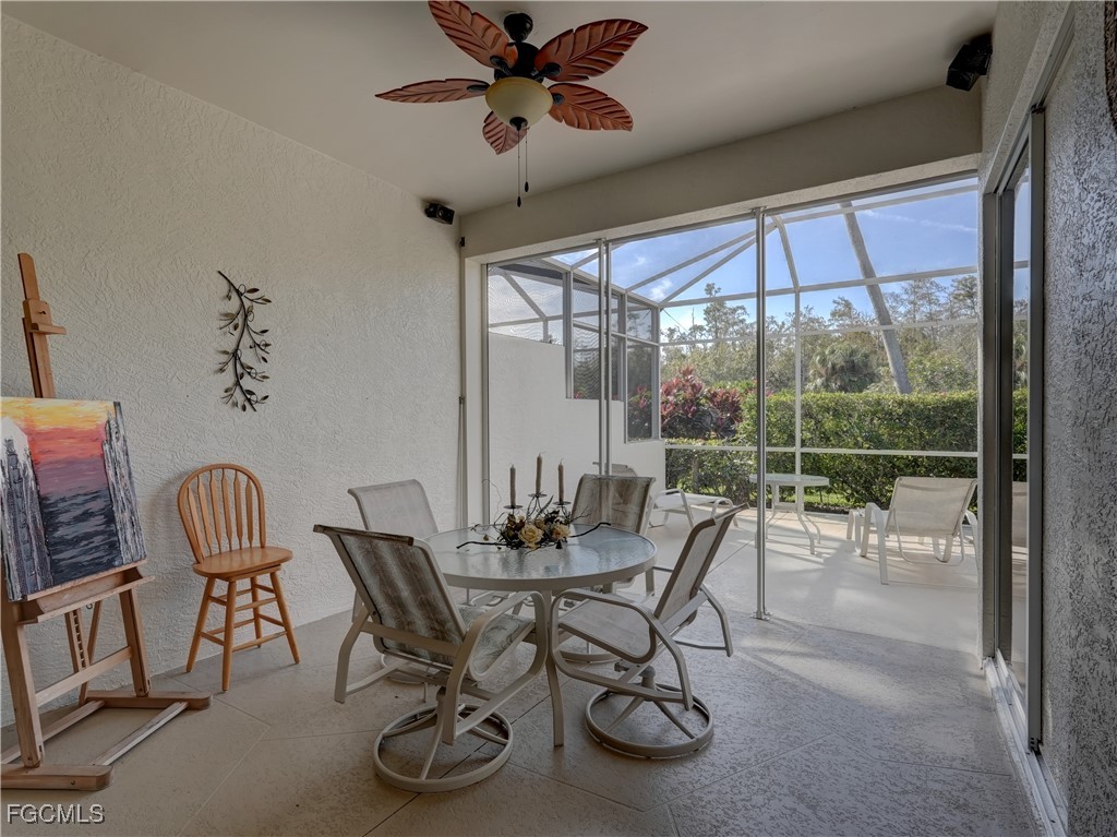 11180 Wine Palm Road Fort Myers, FL 33966 - Photo 30 of 40 a dining room with furniture a chandelier and wooden floor