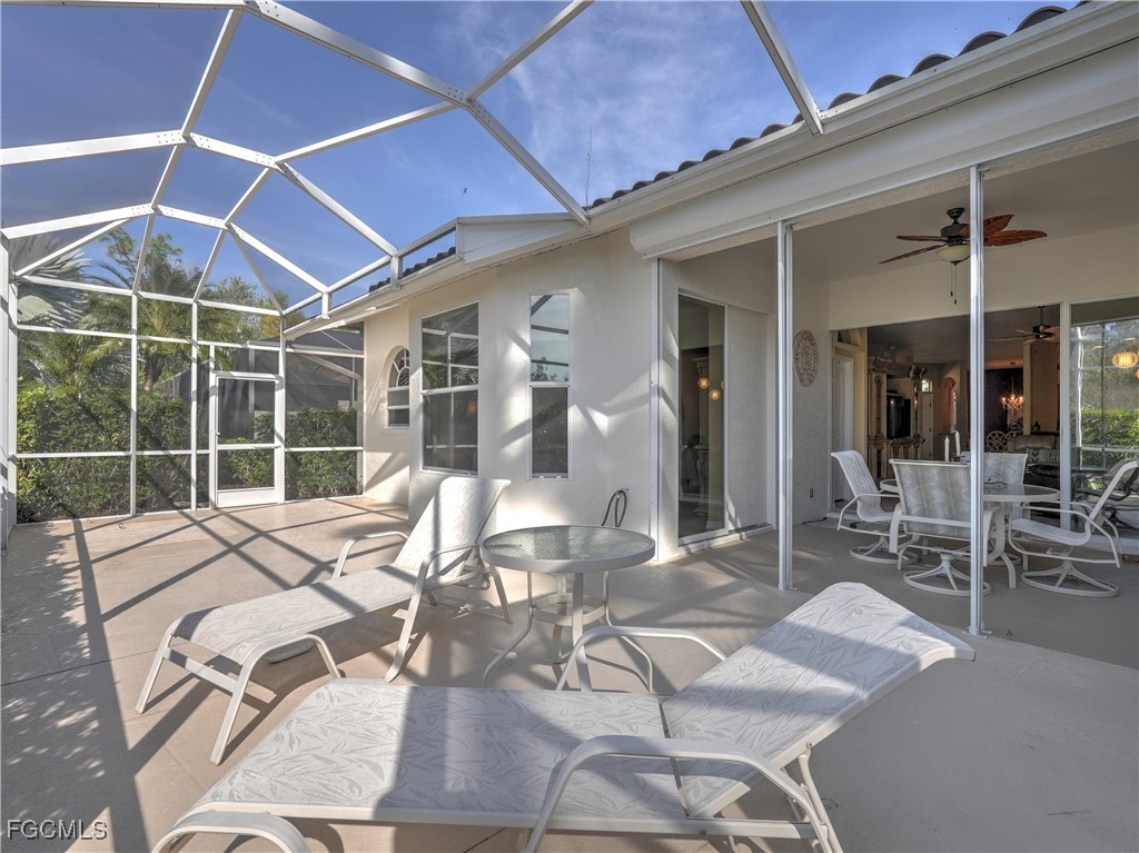 11180 Wine Palm Road Fort Myers, FL 33966 - Photo 32 of 40 a bed room with a bed and glass window