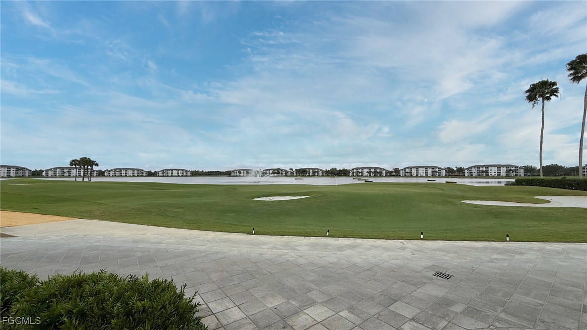 11180 Wine Palm Road Fort Myers, FL 33966 - Photo 38 of 40 a view of a lake with a houses in the background