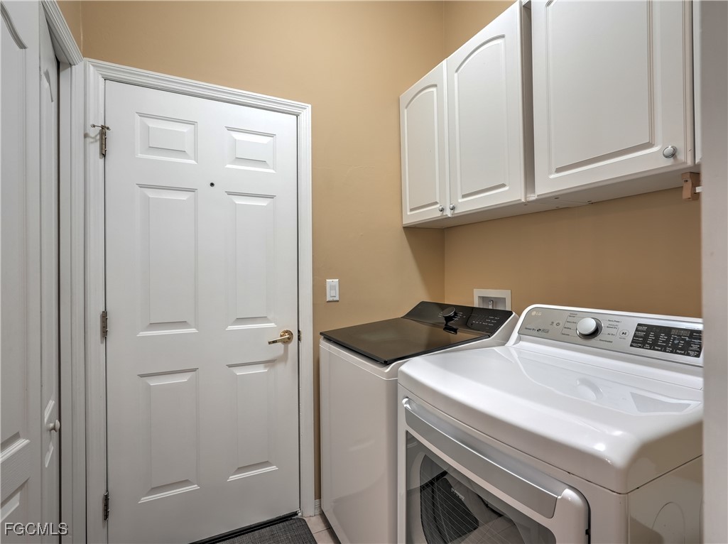 11180 Wine Palm Road Fort Myers, FL 33966 - Photo 9 of 40 a utility room with dryer and washer