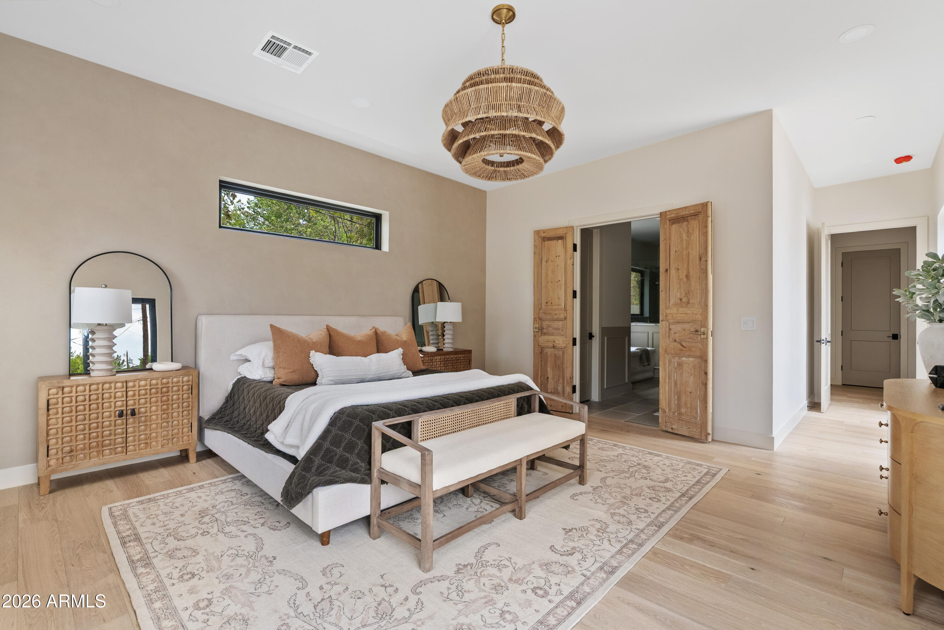 4035 East Osborn Road Phoenix, AZ 85018 - Photo 21 of 63 a bedroom with a bed and a chandelier