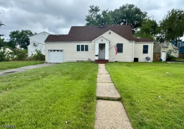 a front view of a house with yard