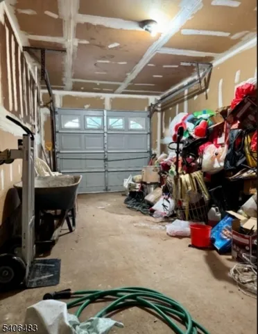 a view of a garage with a bike and car