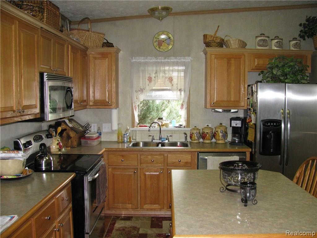 6045 Patrick Road North Branch, MI 48461 - Photo 5 of 44 Kitchen island provides extra seating