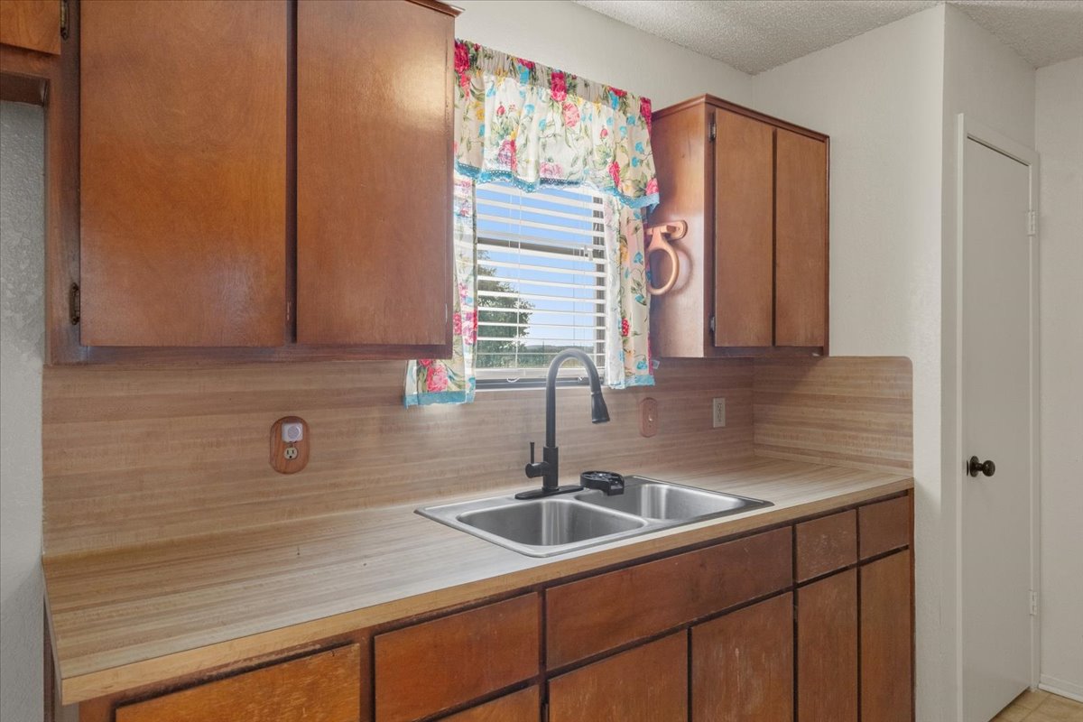 303 Ponderosa Road Bastrop, TX 78602 - Photo 12 of 34 a bathroom with a sink and a mirror