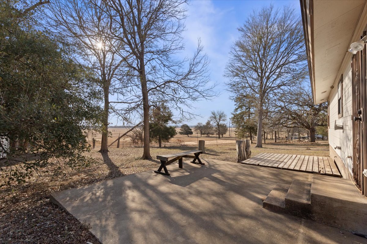 303 Ponderosa Road Bastrop, TX 78602 - Photo 21 of 34 a bench and bench sitting in middle of yard