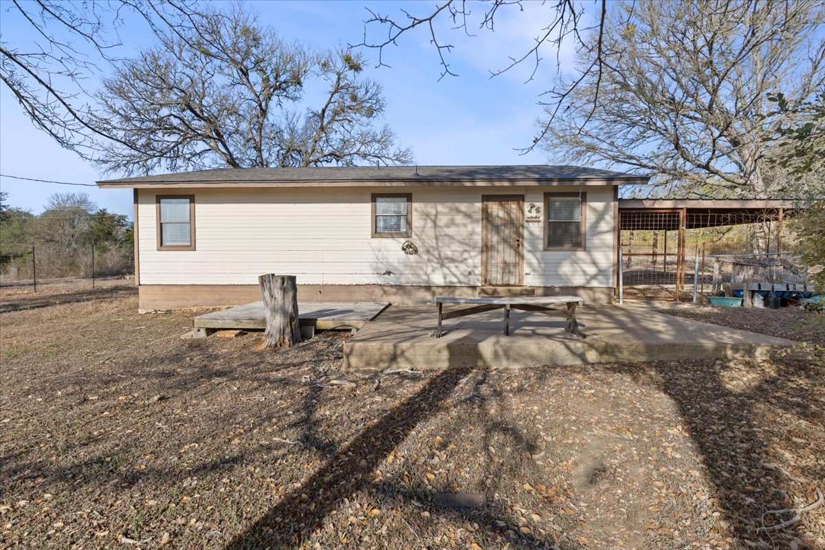 303 Ponderosa Road Bastrop, TX 78602 - Photo 22 of 34 a view of a house with a patio