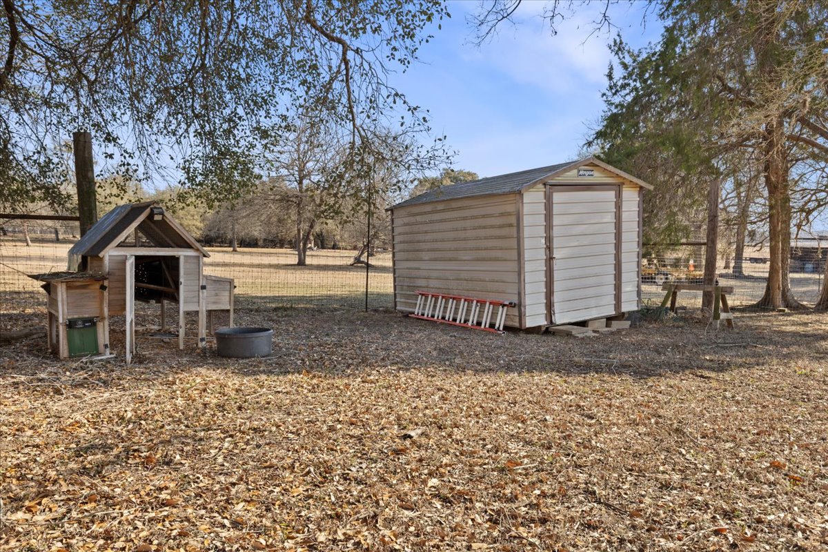 303 Ponderosa Road Bastrop, TX 78602 - Photo 23 of 34 a view of a house with a yard