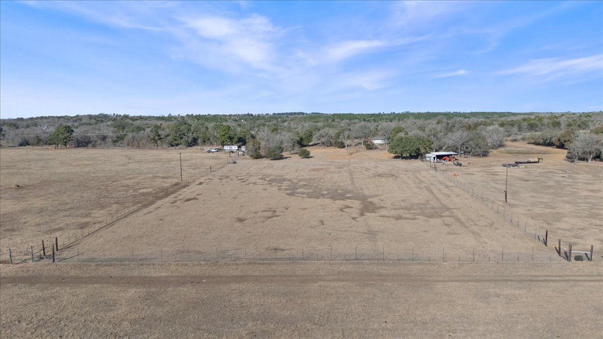 303 Ponderosa Road Bastrop, TX 78602 - Photo 29 of 34 a view of a dry yard with trees