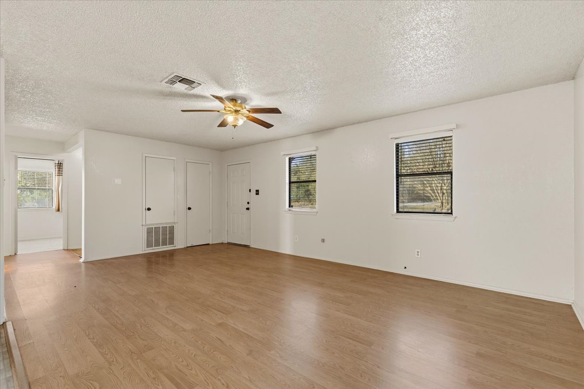 303 Ponderosa Road Bastrop, TX 78602 - Photo 6 of 34 wooden floor in an empty room