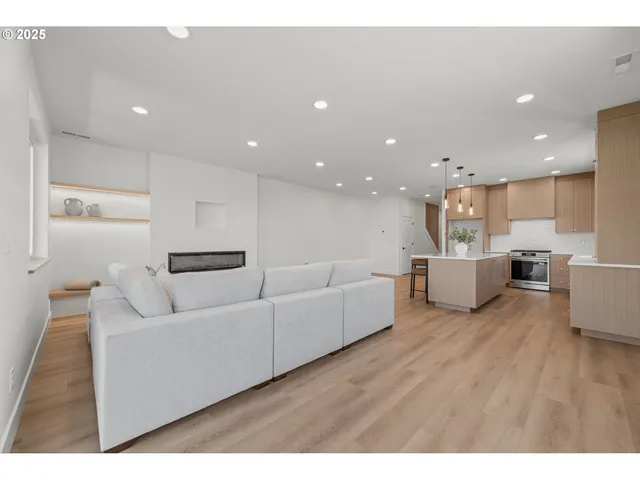 a view of hallway with wooden floor