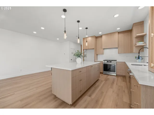 a bathroom with a granite countertop sink a mirror and a shower