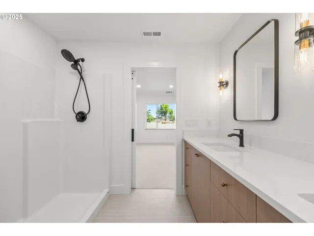 a bathroom with a refrigerator