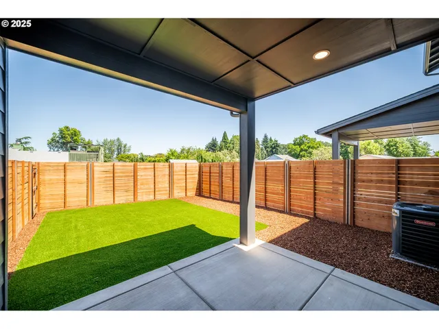 a view of a backyard with a garden
