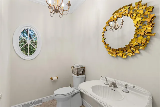 a bathroom with a toilet and a sink