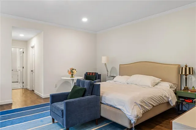 a bedroom with bed and a couch