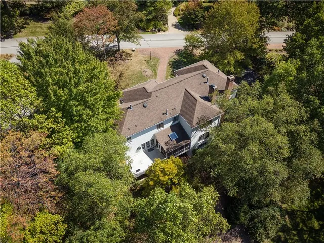 an aerial view of a house with yard and outdoor seating