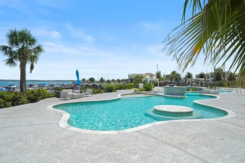 a patio with water view and a city view