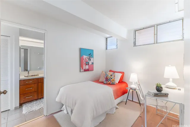 a bedroom with a bed and dresser